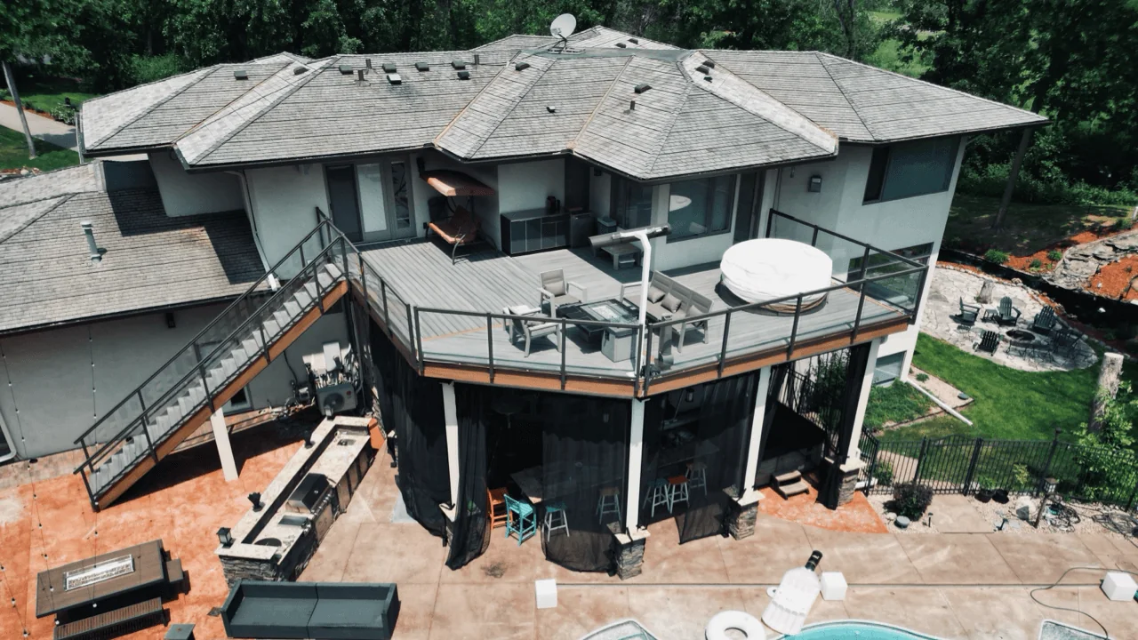 Two-level composite deck around a home