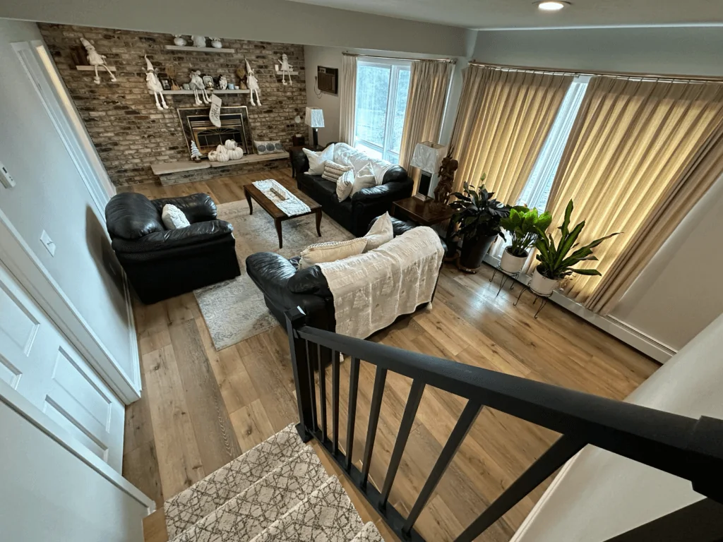 Open living room with stone fireplace
